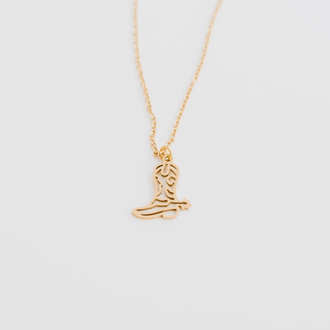 This cowgirl boot necklace is perfect for all those cowgirls events or those who live the lifestyle all day everyday.  With outline details including a spur, this accessory is the idea statement to let everyone know your are a cowgirl at hear. This necklace comes in silver and gold. It is waterproof, tarnish resistent, hypoallergenic and cute as hell.